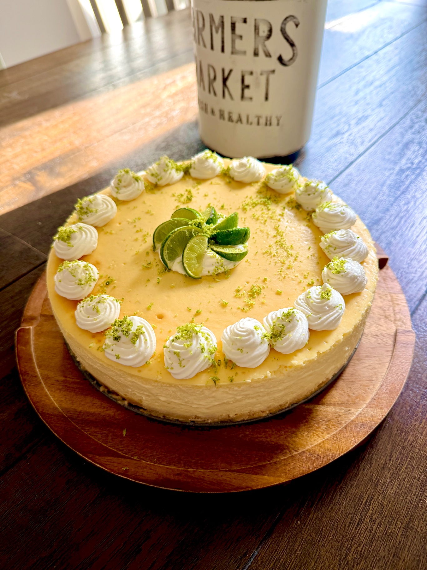 Key Lime Cheesecake with whipped cream rosettes and lime slices